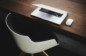 The hand rail is going a little faster than the moving sidewalk.